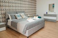 A bed or beds in a room at DOMUS 73 Apulian holidays