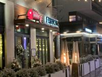 a building with some plants in front of it at Stunning Stayz At Friday Harbour Beach Marina Resort Lake Simcoe Innisfil in Innisfil