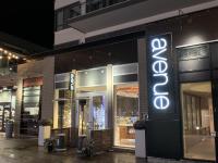 a store with a neon sign in front of it at Stunning Stayz At Friday Harbour Beach Marina Resort Lake Simcoe Innisfil in Innisfil