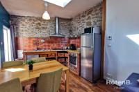 Kuchyňa alebo kuchynka v ubytovaní La Belle Agapanthe-Iris - Maison de ville à Limoges
