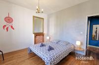 Posteľ alebo postele v izbe v ubytovaní La Belle Agapanthe-Iris - Maison de ville à Limoges