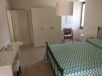 A bed or beds in a room at APPARTAMENTO FONTANE DUE Bagni