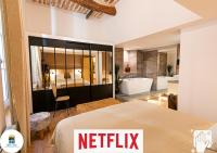 Posteľ alebo postele v izbe v ubytovaní Loft au bèu mitan - 50m2