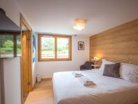 Łóżko lub łóżka w pokoju w obiekcie Bel appart 4* avec jardin privé, à 350m de la Flégère, WIFI, PARKING - FR-1-343-213