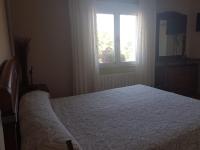 A bed or beds in a room at CASA RURAL EL SAUCE. A 2,5 KM DE CUENCA CAPITAL
