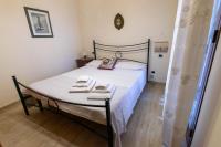 Posteľ alebo postele v izbe v ubytovaní Corallo holiday house Acitrezza