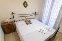 Posteľ alebo postele v izbe v ubytovaní Corallo holiday house Acitrezza