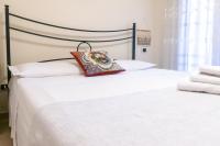 Posteľ alebo postele v izbe v ubytovaní Corallo holiday house Acitrezza
