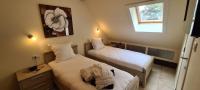 Ein Bett oder Betten in einem Zimmer der Unterkunft Hotel Landhuis &#39;t Wilgenerf