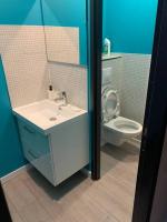 a bathroom with a sink and a toilet at Appartement équipé pour 5 pers in Vénissieux