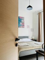A bed or beds in a room at The Roof Garden - Bed&Breakfast
