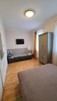 A bed or beds in a room at Gabi Apartman