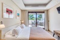 A bed or beds in a room at Hanami Bahia de la Plata Penthouse BDLP10A2A