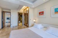 A bed or beds in a room at Hanami Bahia de la Plata Penthouse BDLP10A2A