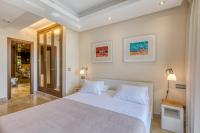 A bed or beds in a room at Hanami Bahia de la Plata Penthouse BDLP10A2A