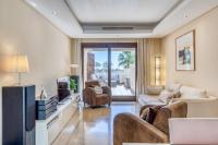 A television and/or entertainment centre at Hanami Bahia de la Plata Penthouse BDLP10A2A