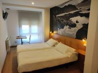 Postel nebo postele na pokoji v ubytování Hotel Dabeleira