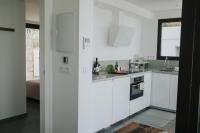 Kuchyň nebo kuchyňský kout v ubytování Suites House Denia