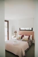 Postel nebo postele na pokoji v ubytování Suites House Denia
