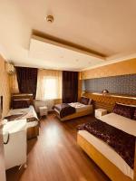 Postel nebo postele na pokoji v ubytování Meta Hotel