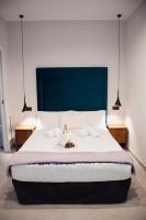 Postel nebo postele na pokoji v ubytování Valencia Apartamentos Goya