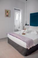 Postel nebo postele na pokoji v ubytování Valencia Apartamentos Goya