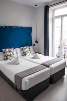 Postel nebo postele na pokoji v ubytování Valencia Apartamentos Goya