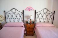 Postel nebo postele na pokoji v ubytování Nerja Paradise Rentals - Villa Flamingo