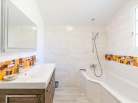 a white bathroom with a sink and a shower at Holiday Home Les Chênes by Interhome in Lit-et-Mixe