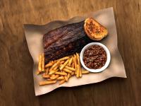 a plate of steak and french fries and a bowl of beans at Thousand Hills Resort Hotel in Branson