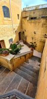 an overhead view of a staircase in a building at Ta Majsi farmhouse with indoor heated pool in San Lawrenz