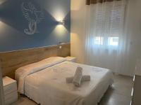 A bed or beds in a room at Fenice42
