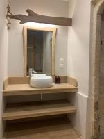 a bathroom with a sink and a mirror at La Maison Saint Joseph in Crépy-en-Valois