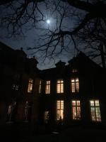 an university building at night with the moon in the sky at La Maison Saint Joseph in Crépy-en-Valois