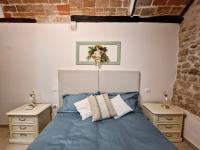 A bed or beds in a room at Casa Adua by TraMonti Apartments