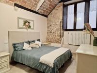 A bed or beds in a room at Casa Adua by TraMonti Apartments