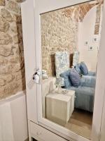 A bed or beds in a room at Casa Adua by TraMonti Apartments