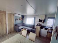 Telewizja i/lub zestaw kina domowego w obiekcie Mobil home 40 m2 camping 4*