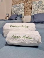 A bed or beds in a room at Casa Adua by TraMonti Apartments