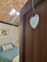 A bed or beds in a room at Casa Adua by TraMonti Apartments