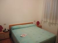 A bed or beds in a room at Villa Katiò