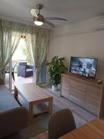 Televízia a/alebo spoločenská miestnosť v ubytovaní Apartamento Maya Relax Salou