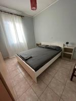 A bed or beds in a room at Lixouri Center Apartment