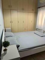 A bed or beds in a room at Lixouri Center Apartment