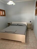 A bed or beds in a room at Lixouri Center Apartment