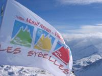 a flag on top of a snow covered mountain at Studio Pegase Phenix-44 by Interhome in Le Corbier