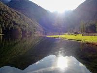 a body of water with the reflection of a mountain at Apartment Poldi by Interhome in Haus im Ennstal