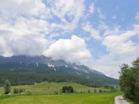 a green field with a mountain in the background at Apartment Poldi by Interhome in Haus im Ennstal