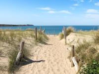 a sandy path to the beach near the ocean at Holiday Home La Vallée by Interhome in Cancale