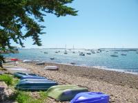 a group of boats on the shore of a beach at Holiday Home Penn Ar Bed - PBA114 by Interhome in Pleubian